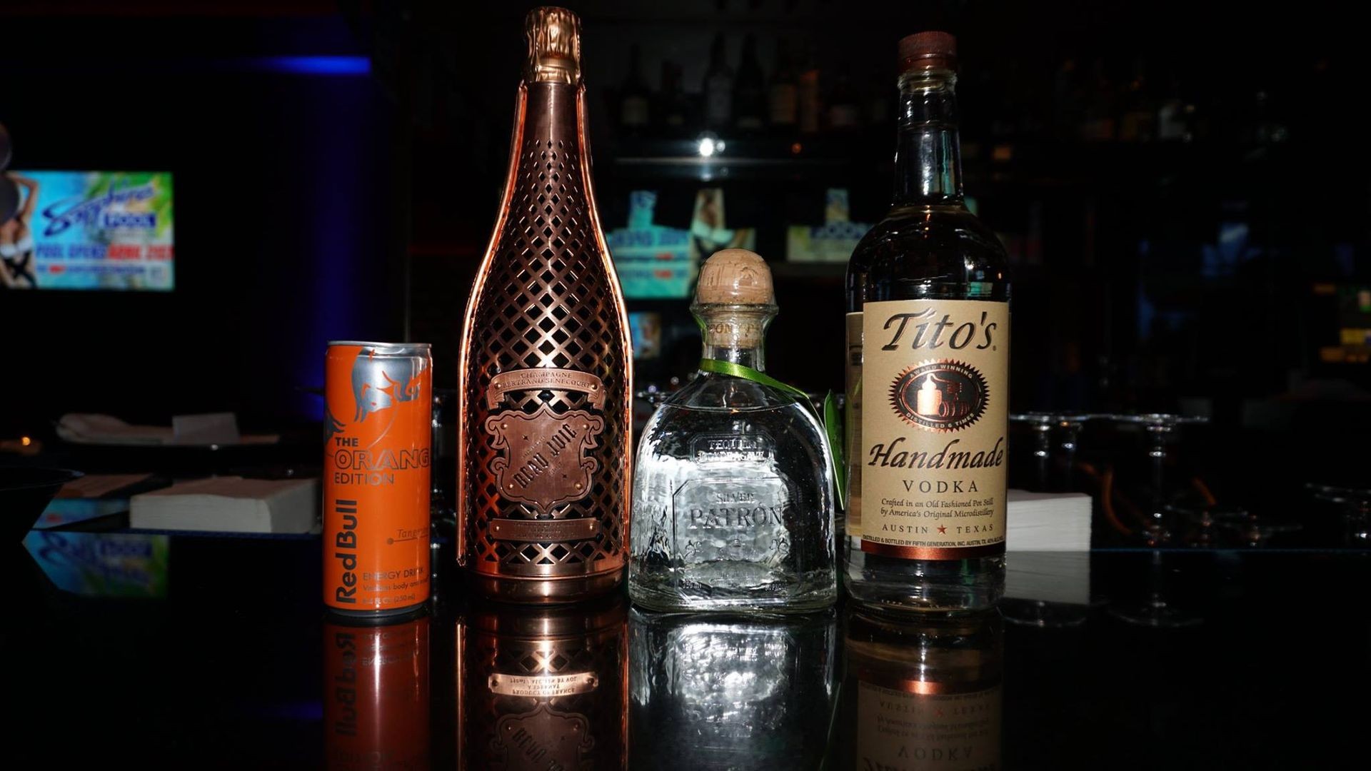 VIP bottle service package at Las Vegas strip clubs, offering handcrafted cocktails and private seating for Texas guests.